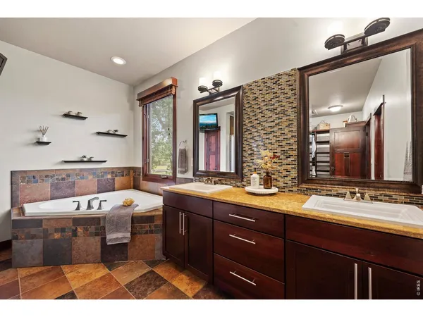 a large bathroom with a sink double vanity
