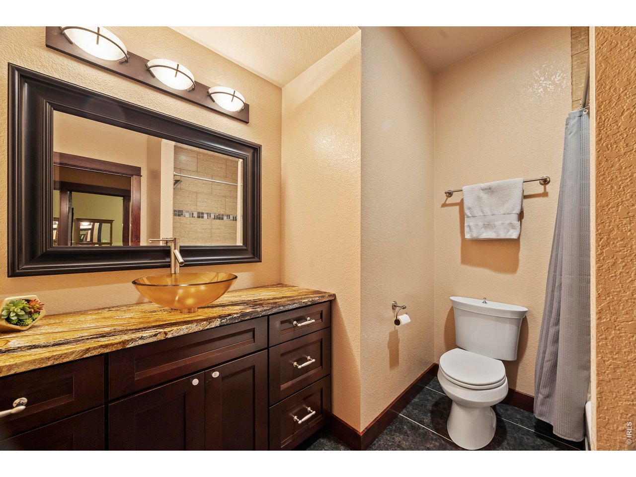 37127 Cullison Ridge Road Severance, CO 80550 - Photo 31 of 50 a bathroom with a toilet a sink and mirror