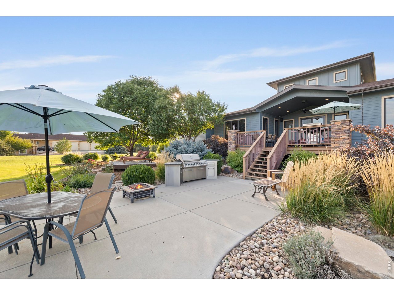 37127 Cullison Ridge Road Severance, CO 80550 - Photo 37 of 50 a view of a patio with a table and chairs under an umbrella