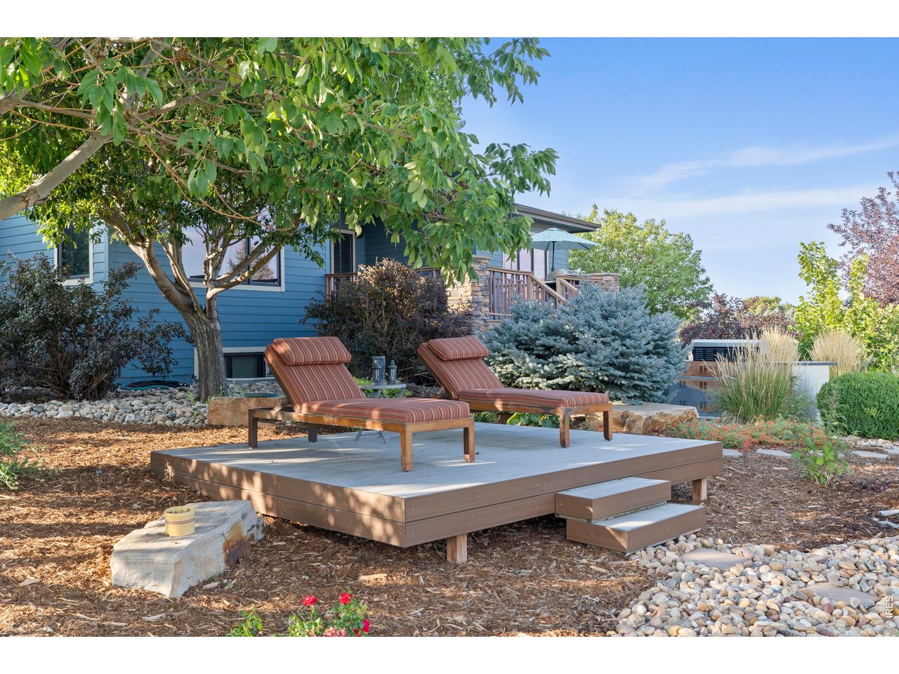 37127 Cullison Ridge Road Severance, CO 80550 - Photo 39 of 50 a white bench sitting in the middle of a yard