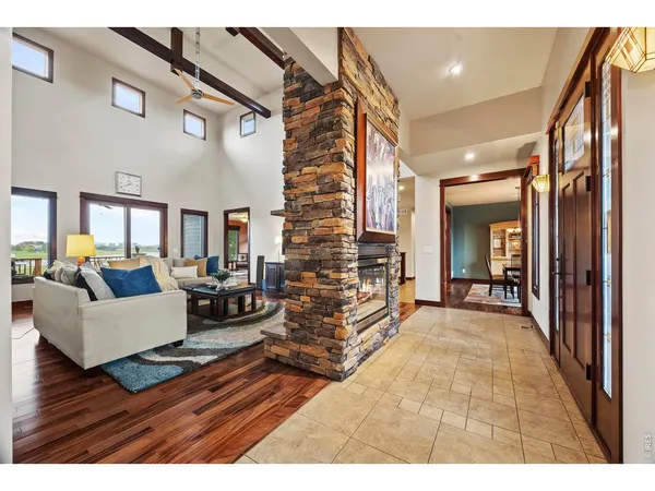 a view of a livingroom with furniture and hardwood floor