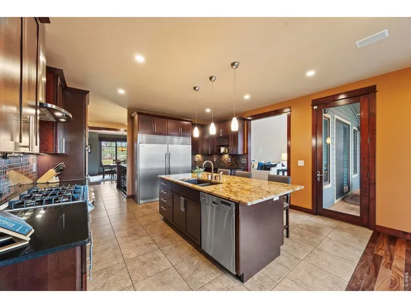 a kitchen with kitchen island granite countertop lots of counter top space