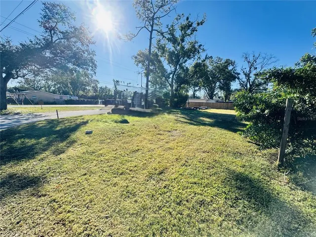 a view of a swimming pool with an outdoor space and seating area