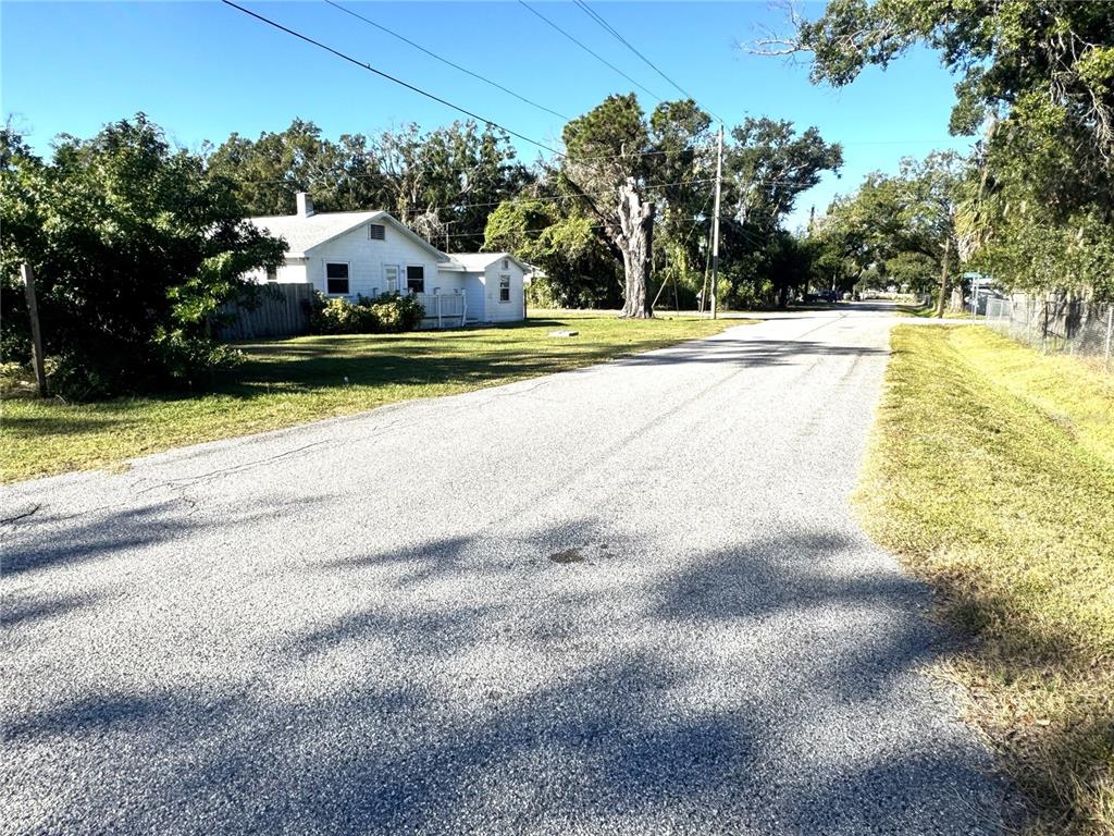 12324 4 Oaks Road Tampa, FL 33624 - Photo 6 of 7 a view of a swimming pool with a yard