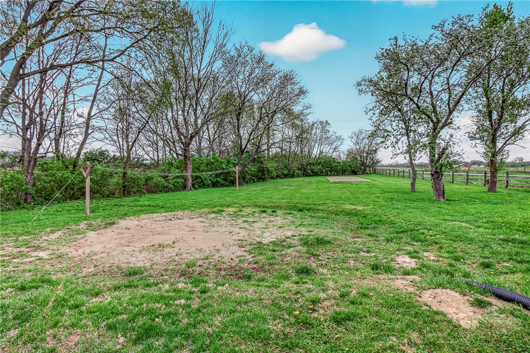 8700 Quaker Trace Road Camden, OH 45311 - Photo 25 of 34 This spacious yard features mature trees and ample green space for outdoor activities.