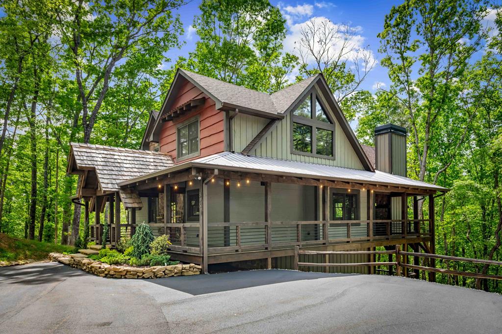 895 Price Road Blue Ridge, GA 30513 - Photo 106 of 140 a front view of a house with a garden