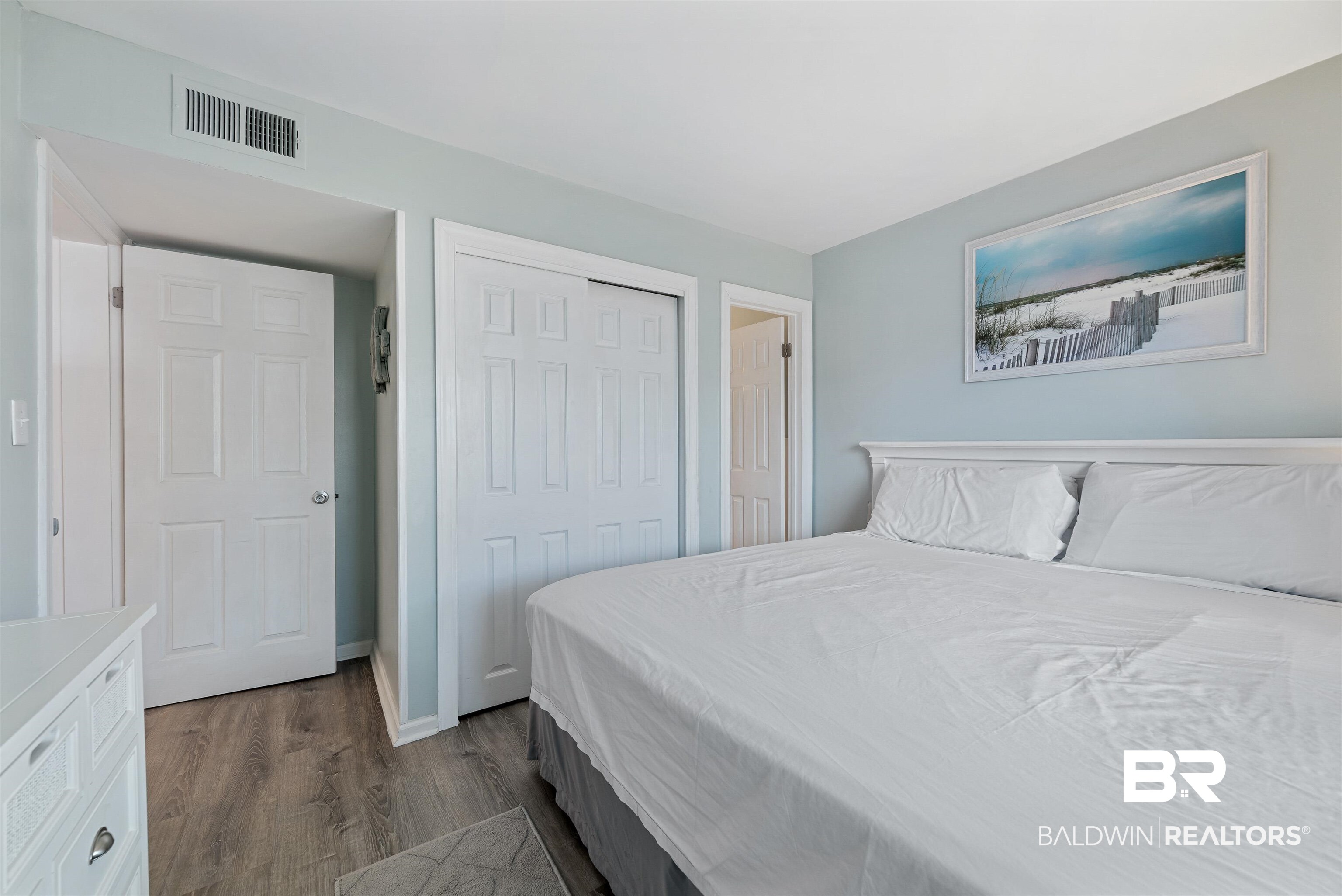 400 Plantation Road, Unit 2123 Gulf Shores, AL 36542 - Photo 16 of 44 Bedroom with dark hardwood / wood-style floors and a closet