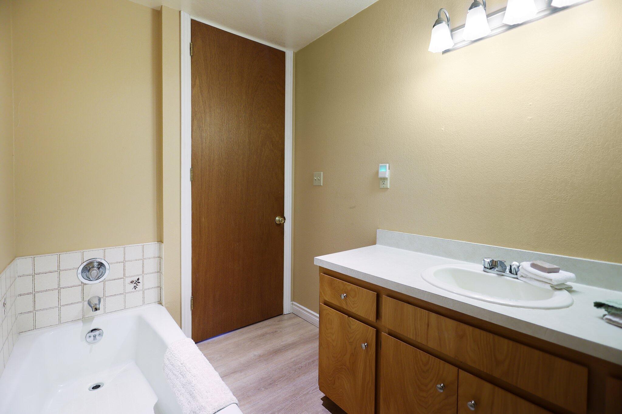 21800 Cedar Ridge Road Manton, CA 96059 - Photo 12 of 35 a bathroom with a sink and a bathtub
