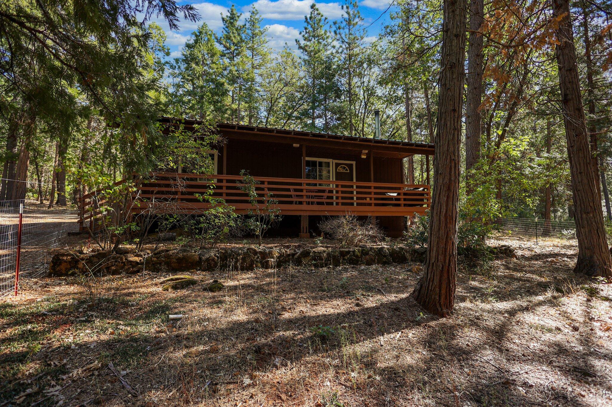 21800 Cedar Ridge Road Manton, CA 96059 - Photo 23 of 35 a backyard of a house with barbeque oven table and chairs