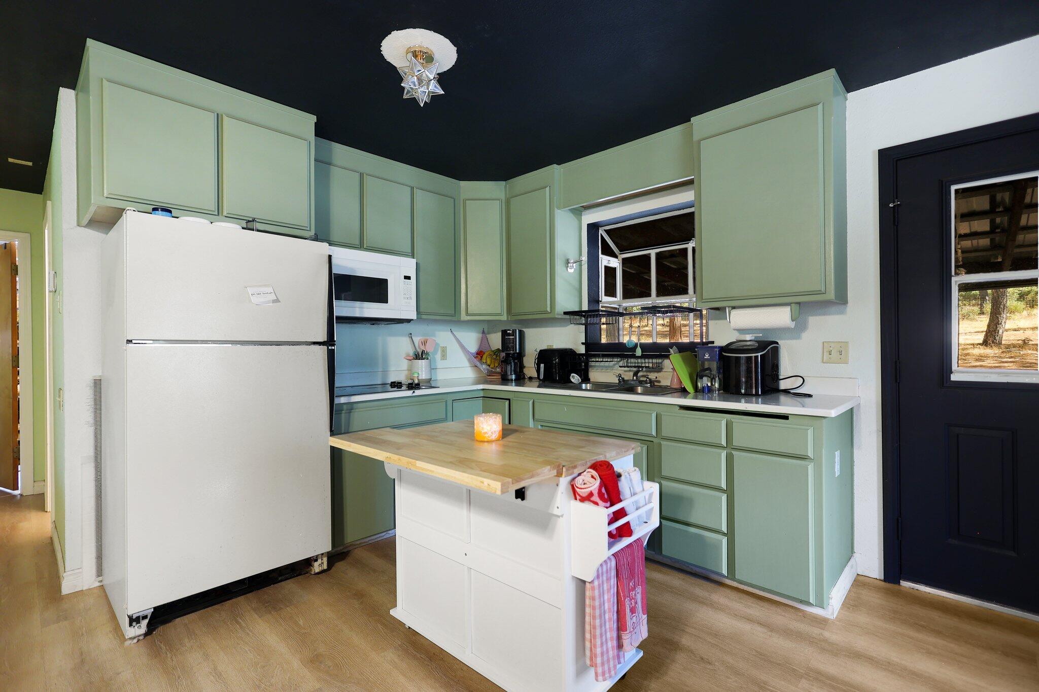 21800 Cedar Ridge Road Manton, CA 96059 - Photo 25 of 35 a kitchen with stainless steel appliances granite countertop a refrigerator a sink dishwasher a stove and a refrigerator