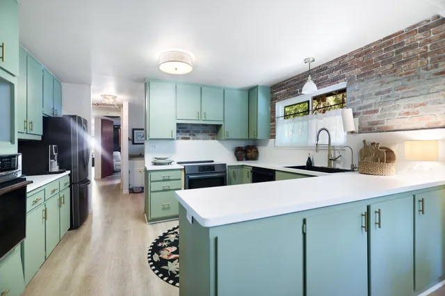 a kitchen with a sink and cabinets