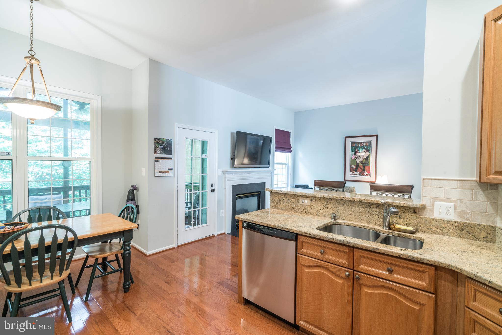 20691 Riptide Square Sterling, VA 20165 - Photo 9 of 27 Eat-In Kitchen, Open to Family Room w/Fireplace!