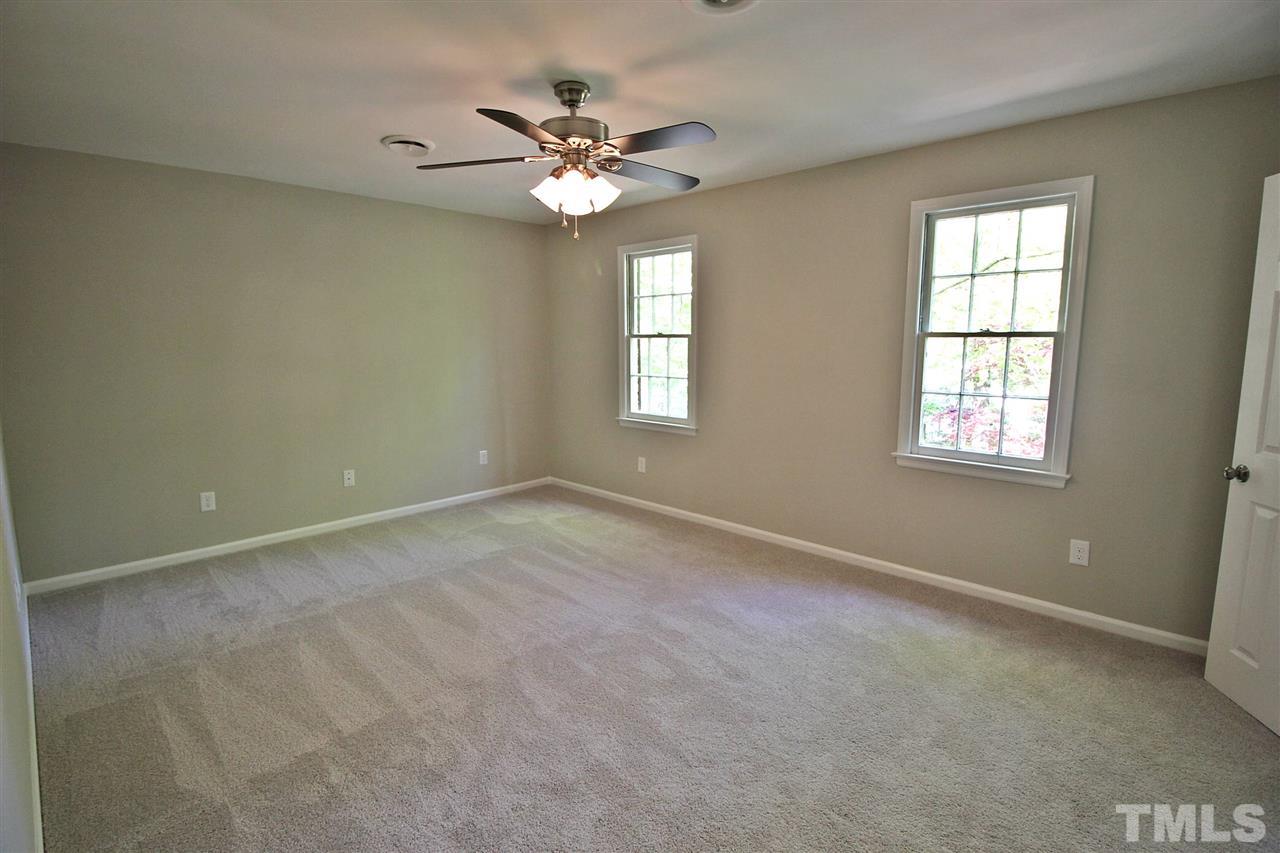 5512 Mapleridge Road Raleigh, NC 27609 - Photo 14 of 23 a view of an empty room with a window
