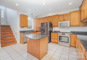 836 Brookfield Circle Salisbury, NC 28146 - Photo 20 of 42 a kitchen with stainless steel appliances granite countertop a refrigerator and a stove top oven