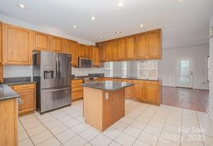 836 Brookfield Circle Salisbury, NC 28146 - Photo 21 of 42 a kitchen with stainless steel appliances granite countertop a refrigerator and a stove top oven