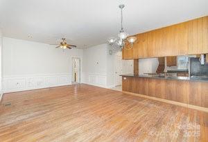 836 Brookfield Circle Salisbury, NC 28146 - Photo 23 of 42 a view of a kitchen with kitchen island a sink stainless steel appliances and cabinets