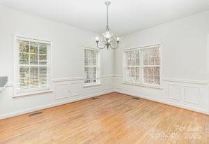 836 Brookfield Circle Salisbury, NC 28146 - Photo 25 of 42 a view of an empty room with a window and chandelier