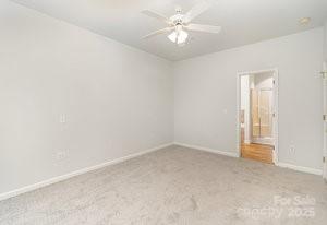 836 Brookfield Circle Salisbury, NC 28146 - Photo 27 of 42 an empty room with a window and a ceiling fan