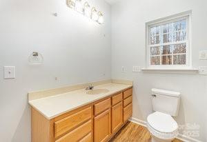 836 Brookfield Circle Salisbury, NC 28146 - Photo 29 of 42 a bathroom with a sink a toilet and a window