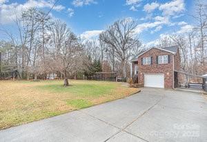 836 Brookfield Circle Salisbury, NC 28146 - Photo 4 of 42 a front view of a house with a yard and garage