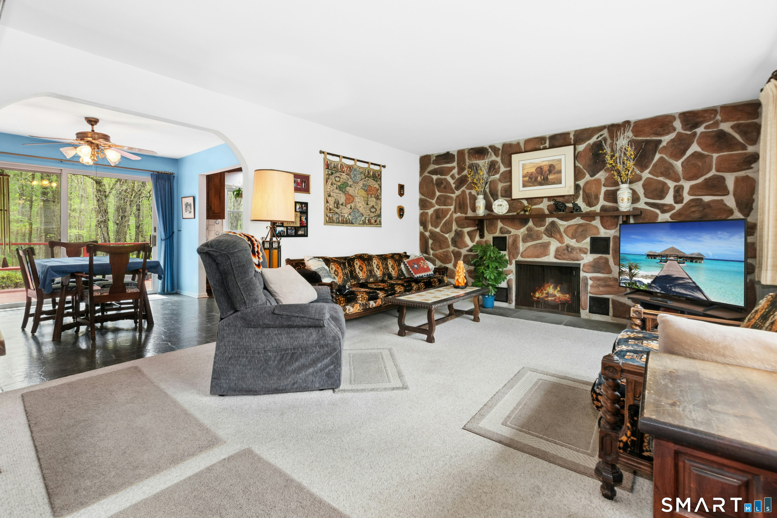 15 Limestone Terrace Ridgefield, CT 06877 - Photo 5 of 32 a living room with furniture a rug and a table