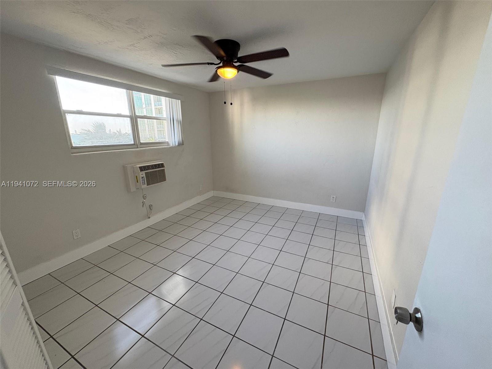 505 Northeast 30th Street, Unit 506 Miami, FL 33137 - Photo 12 of 26 a view of an empty room and window