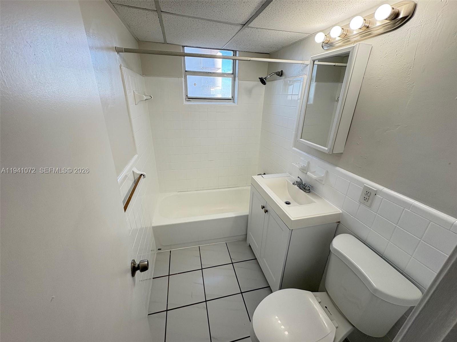 505 Northeast 30th Street, Unit 506 Miami, FL 33137 - Photo 14 of 26 a bathroom with a sink toilet and shower