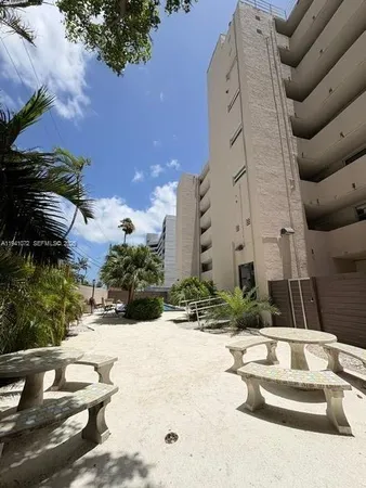 a view of a backyard with plants