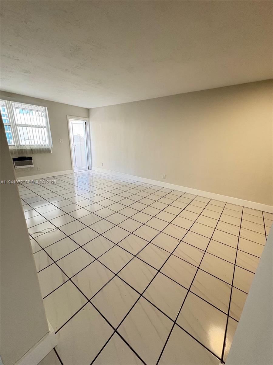 505 Northeast 30th Street, Unit 506 Miami, FL 33137 - Photo 7 of 26 a view of an empty room and window