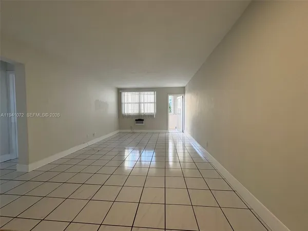 a view of an empty room and window