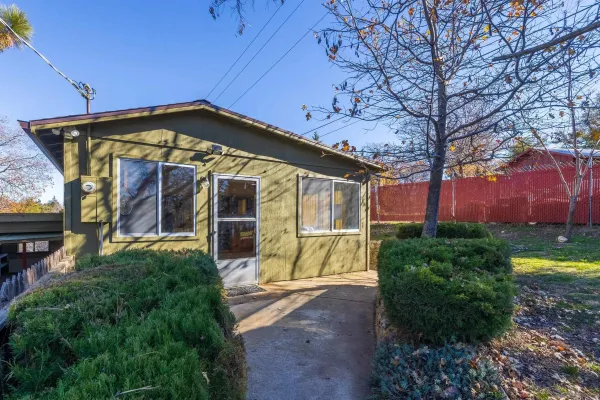a view of a house with a yard