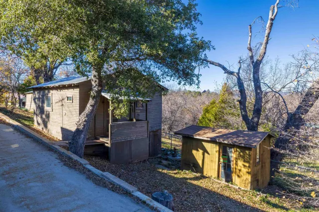 a view of a patio with a table and chairs