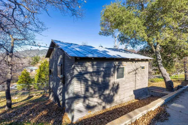 a view of a house with a tree