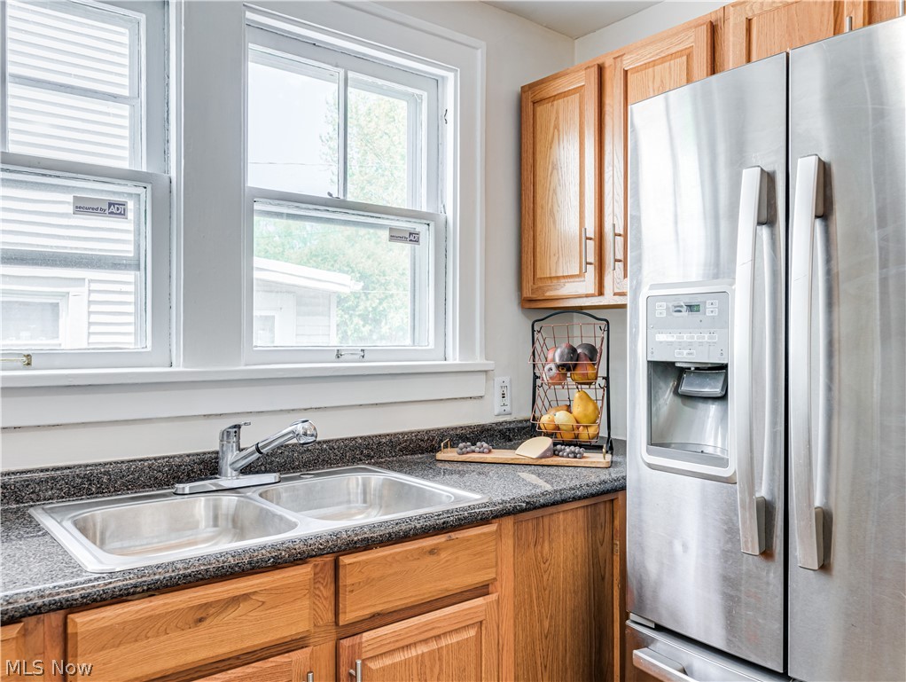 377 East Wilbeth Road Akron, OH 44301 - Photo 9 of 25 Kitchen with stainless steel fridge with ice dispenser and sink