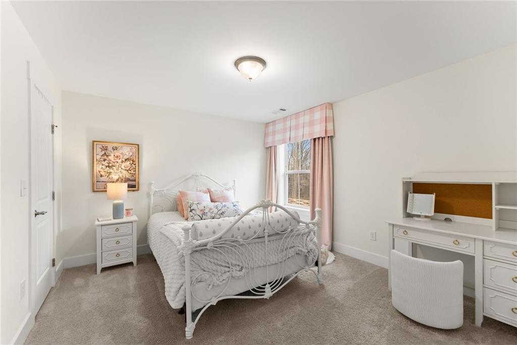 6998 Britt Gailey Road Clermont, GA 30527 - Photo 50 of 92 a bedroom with furniture and flat screen tv