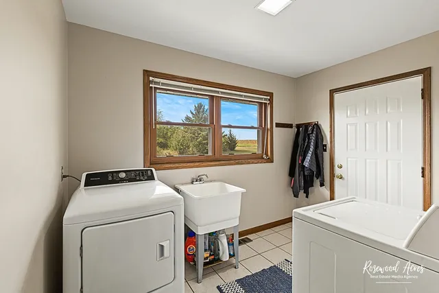 a kitchen with stainless steel appliances kitchen island granite countertop a stove and cabinets