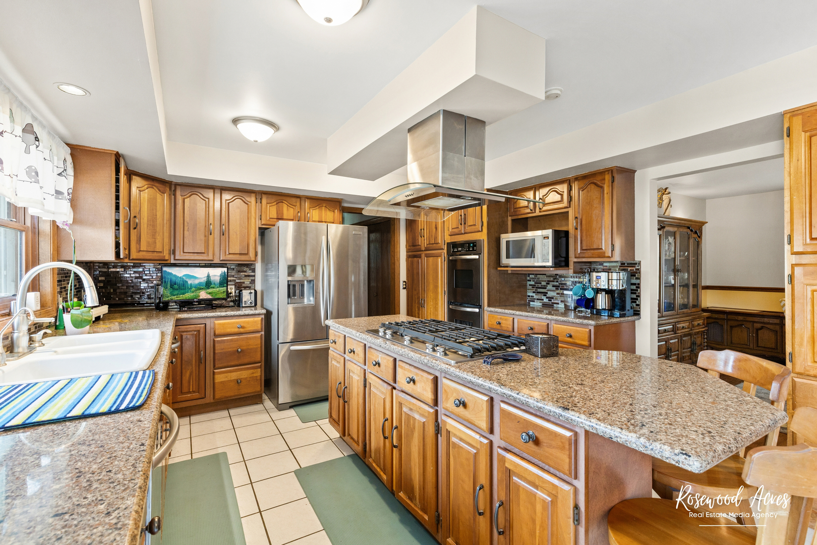 4196 North 2250W Road Bourbonnais, IL 60914 - Photo 20 of 61 a kitchen with stainless steel appliances granite countertop a stove a sink dishwasher a refrigerator a oven and couches with wooden floor