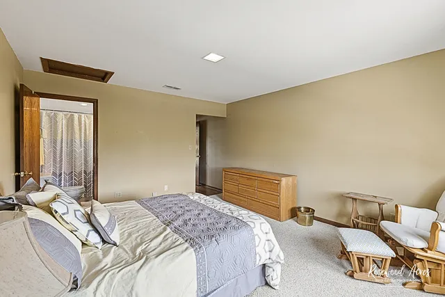 a living room with furniture a flat screen tv and a large window