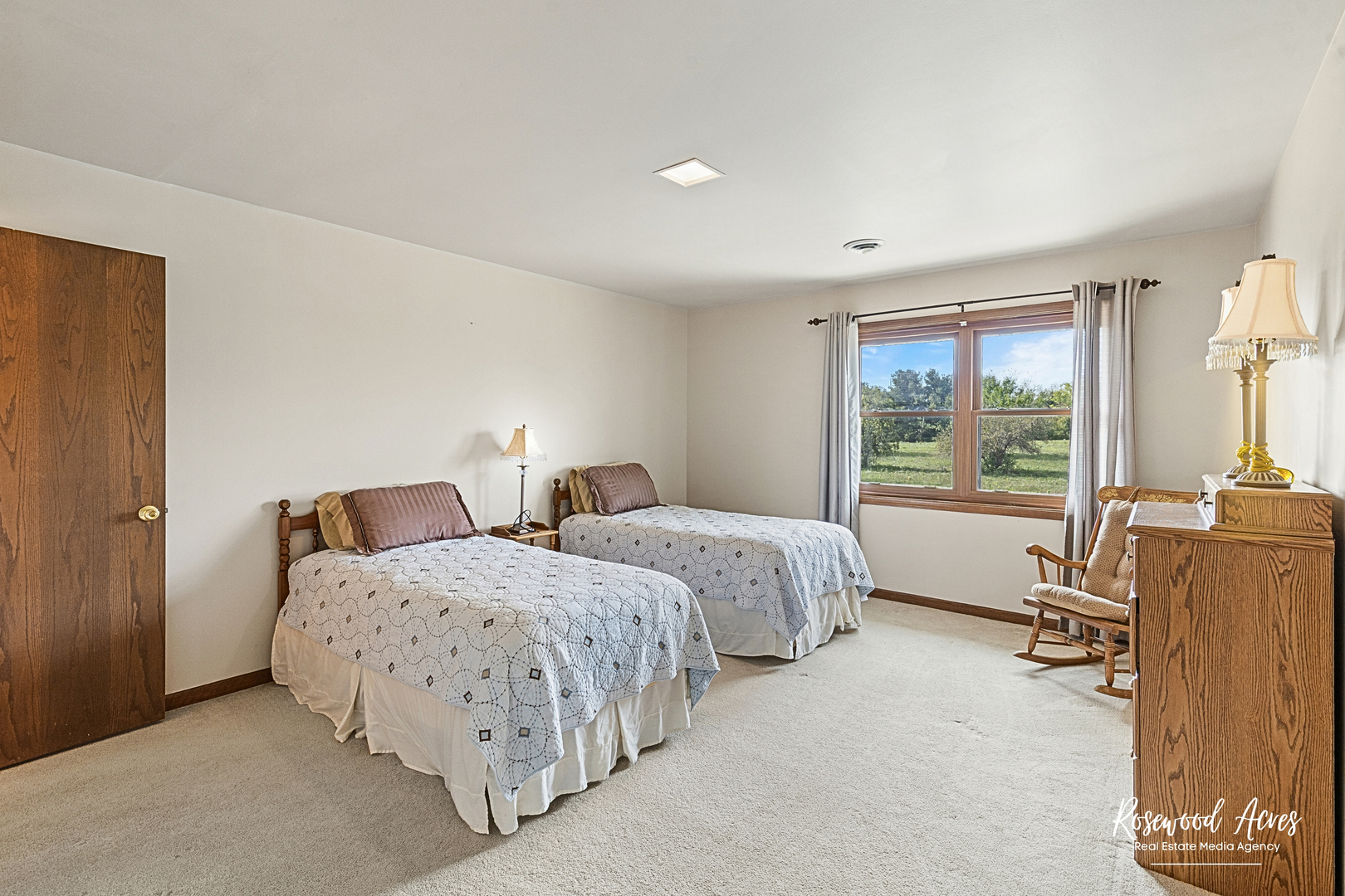4196 North 2250W Road Bourbonnais, IL 60914 - Photo 28 of 61 a spacious bedroom with two beds and large windows