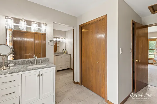 a bathroom with a bathtub and a sink