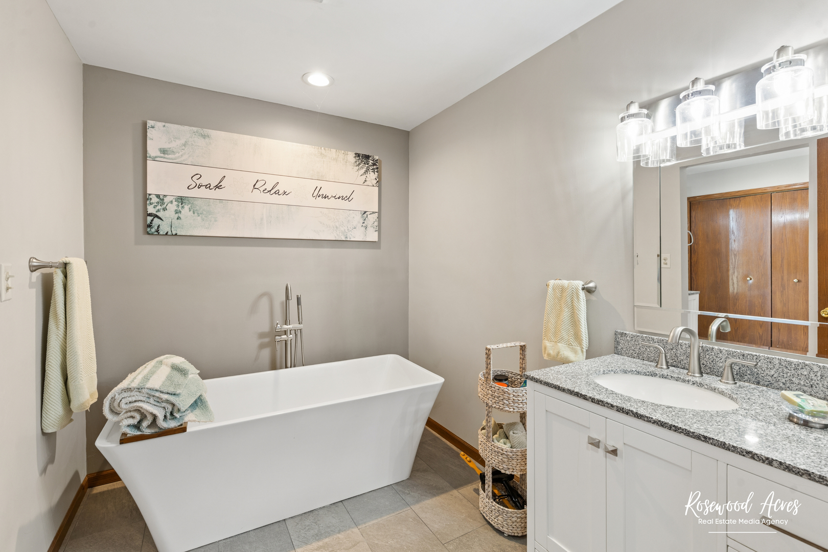 4196 North 2250W Road Bourbonnais, IL 60914 - Photo 35 of 61 a bathroom with a granite countertop sink a mirror and a bathtub
