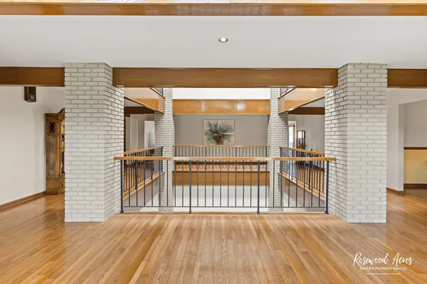 a view of outdoor space with wooden floor and windows