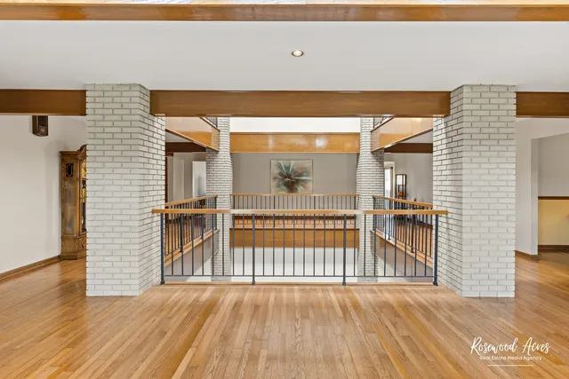 a view of outdoor space with wooden floor and windows