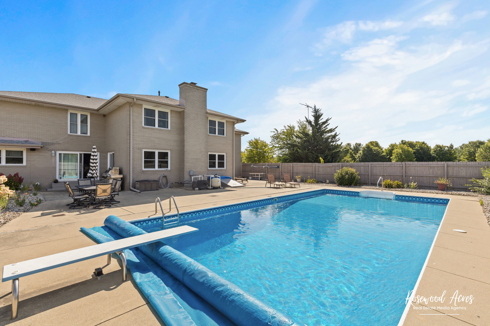 4196 North 2250W Road Bourbonnais, IL 60914 - Photo 55 of 61 a view of a house with pool lawn chairs and a fire pit