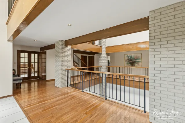 a view of a porch with wooden floor