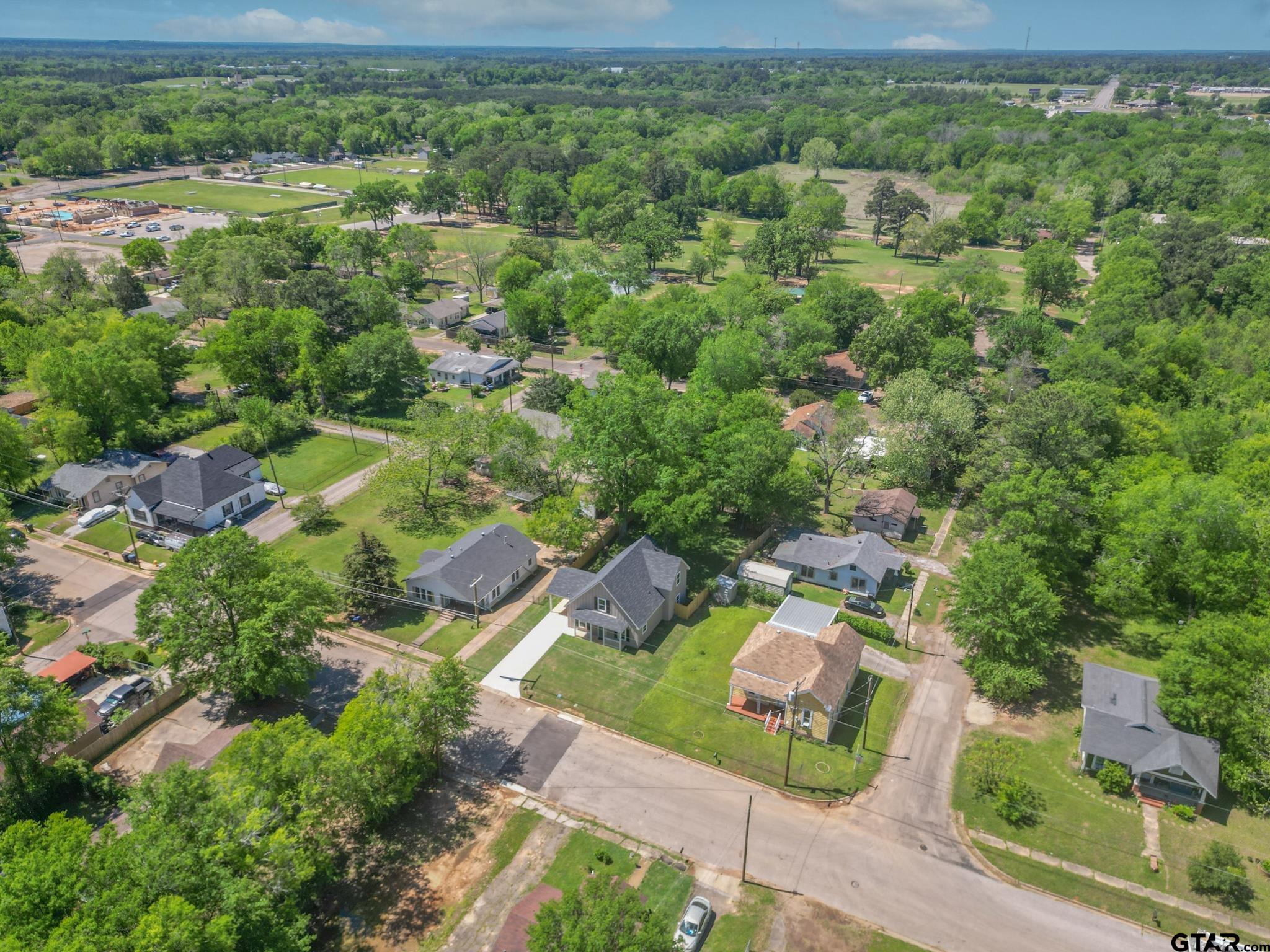 233 Harrison Street Longview, TX 75601 - Photo 3 of 44 an aerial view of a house with yard
