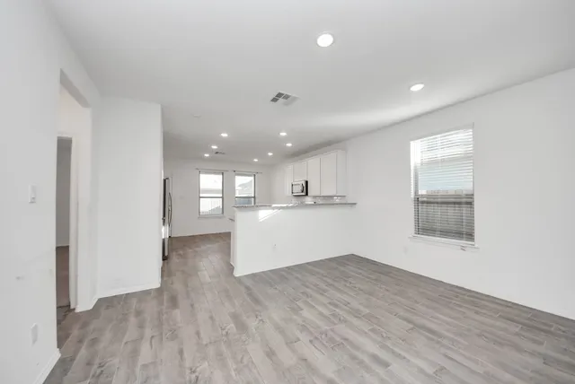 a view of kitchen with wooden floor