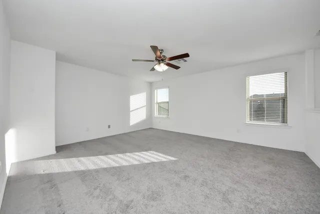 a view of an empty room with a window