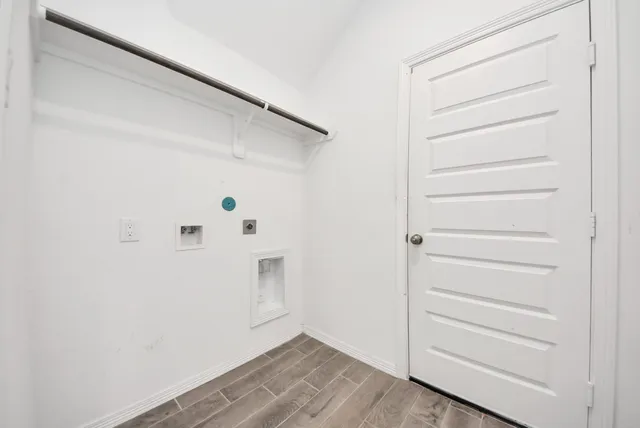 a bathroom with a granite countertop sink toilet mirror and bathtub