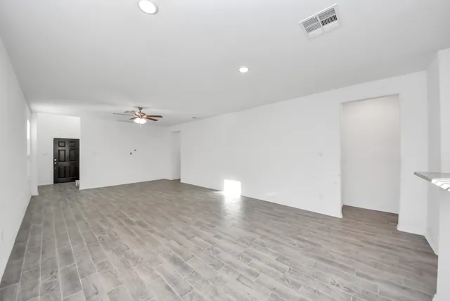 a view of an empty room with a window